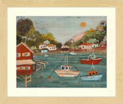 Painting of a harbor scene with boats and houses, framed in beige.